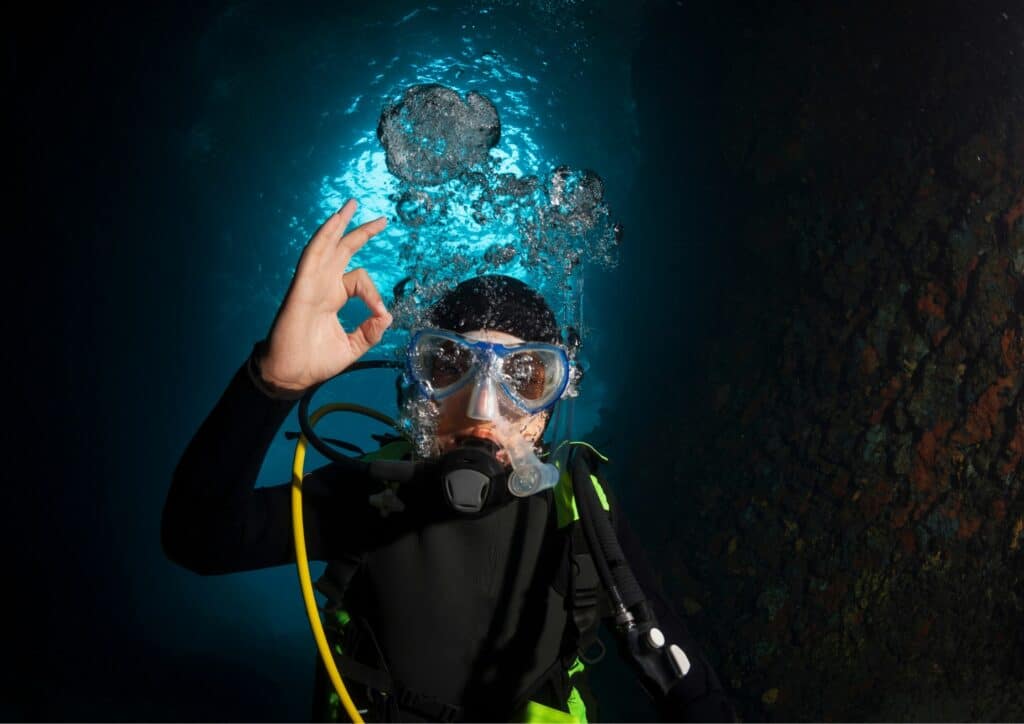 underwater adventure - cave diving ok sign